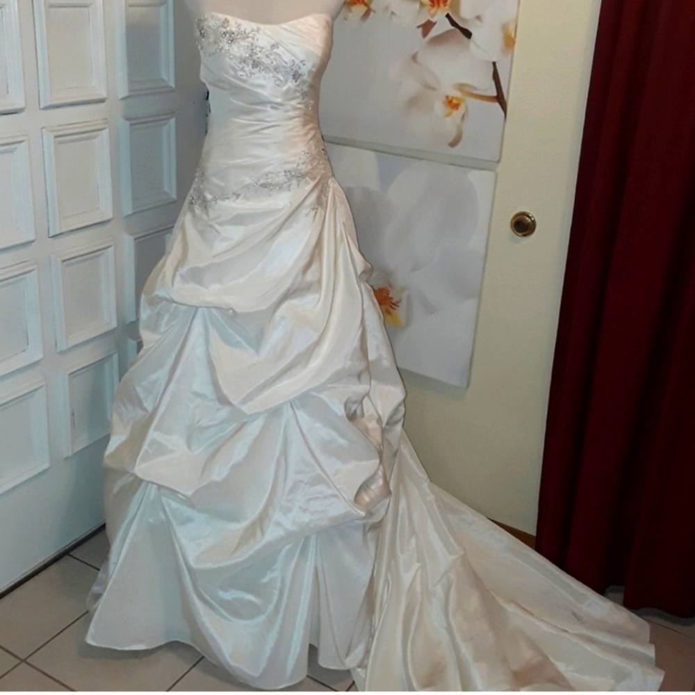 Wedding dress is not pure white...it's a little off-white